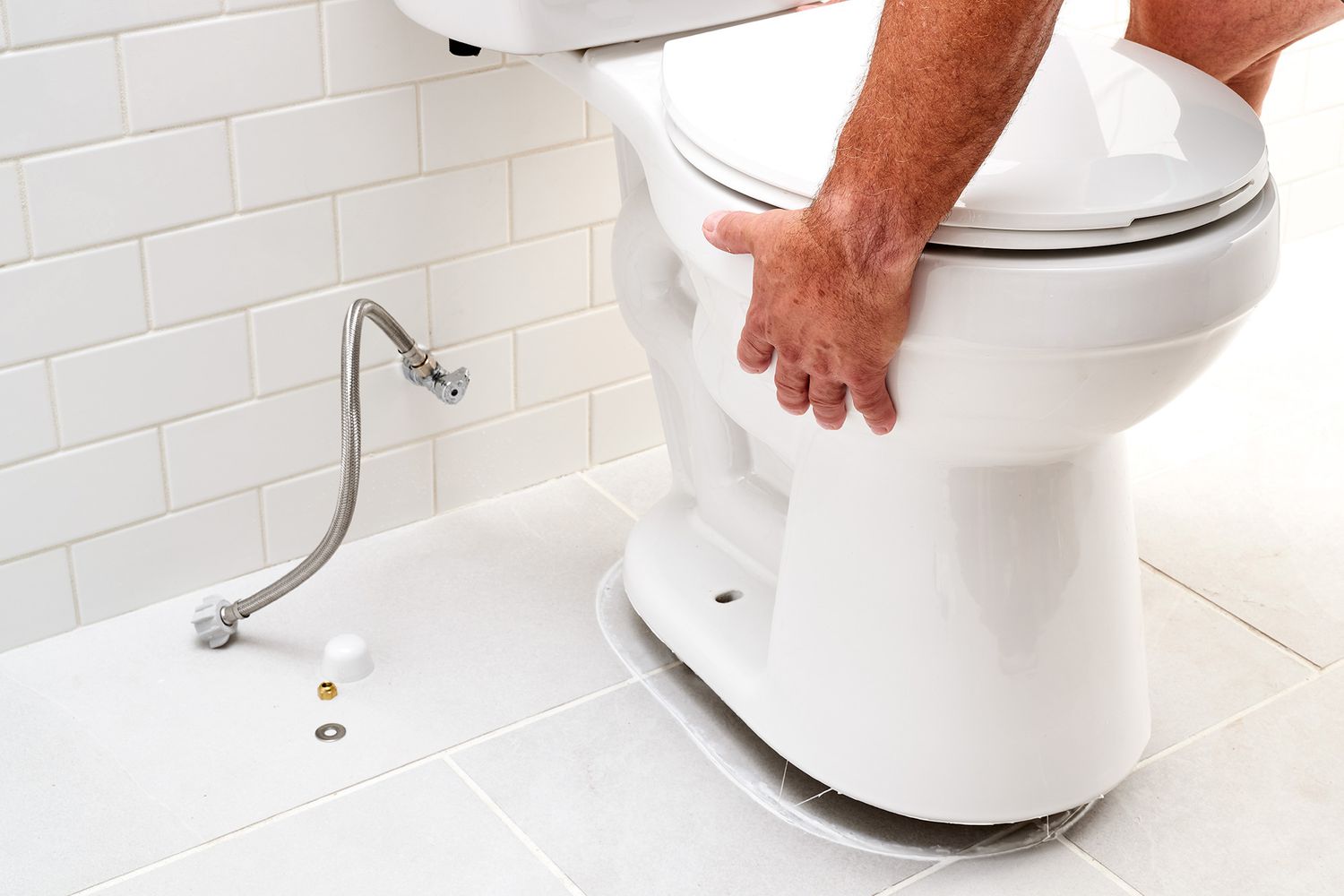 Plumbing codes require caulking a toilet to the floor