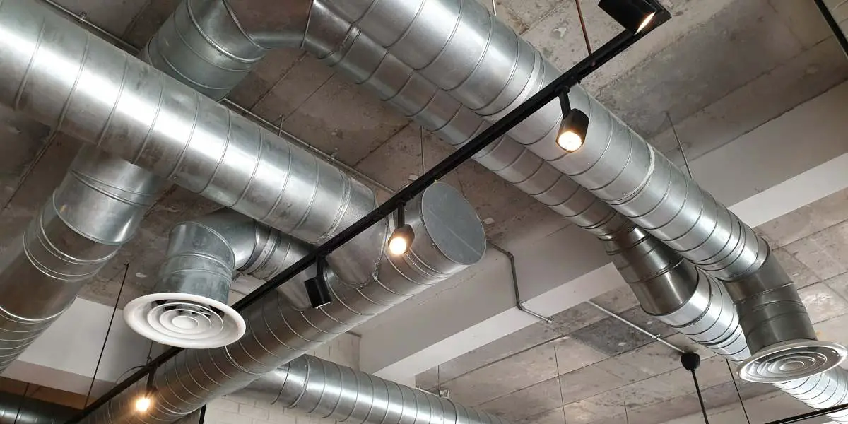 Ventilation,Pipes,In,Silver,Insulation,Material,Hanging,From,The,Ceiling